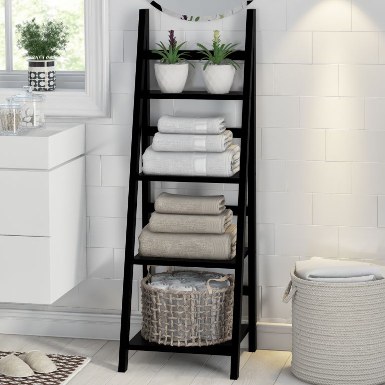 a black ladder is a space-saving storage unit for any bathroom, it works not only for towels but also for other pieces