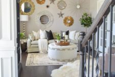 16 a catchy and bright gallery wall with mirrors in gold and silver frames and various stars here and there