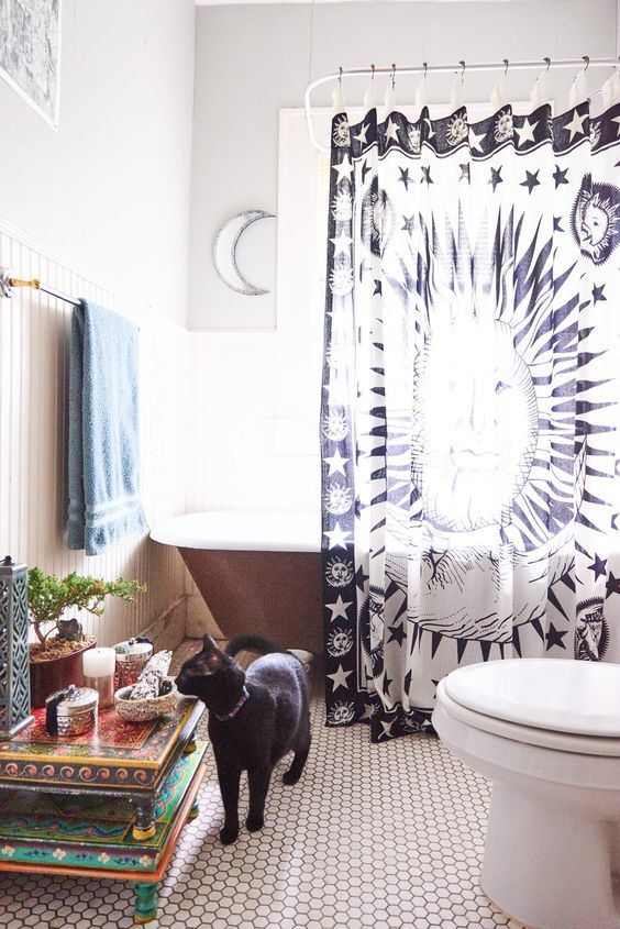 A celestial navy and white printed curtain for a cool celestial touch in the bathroom
