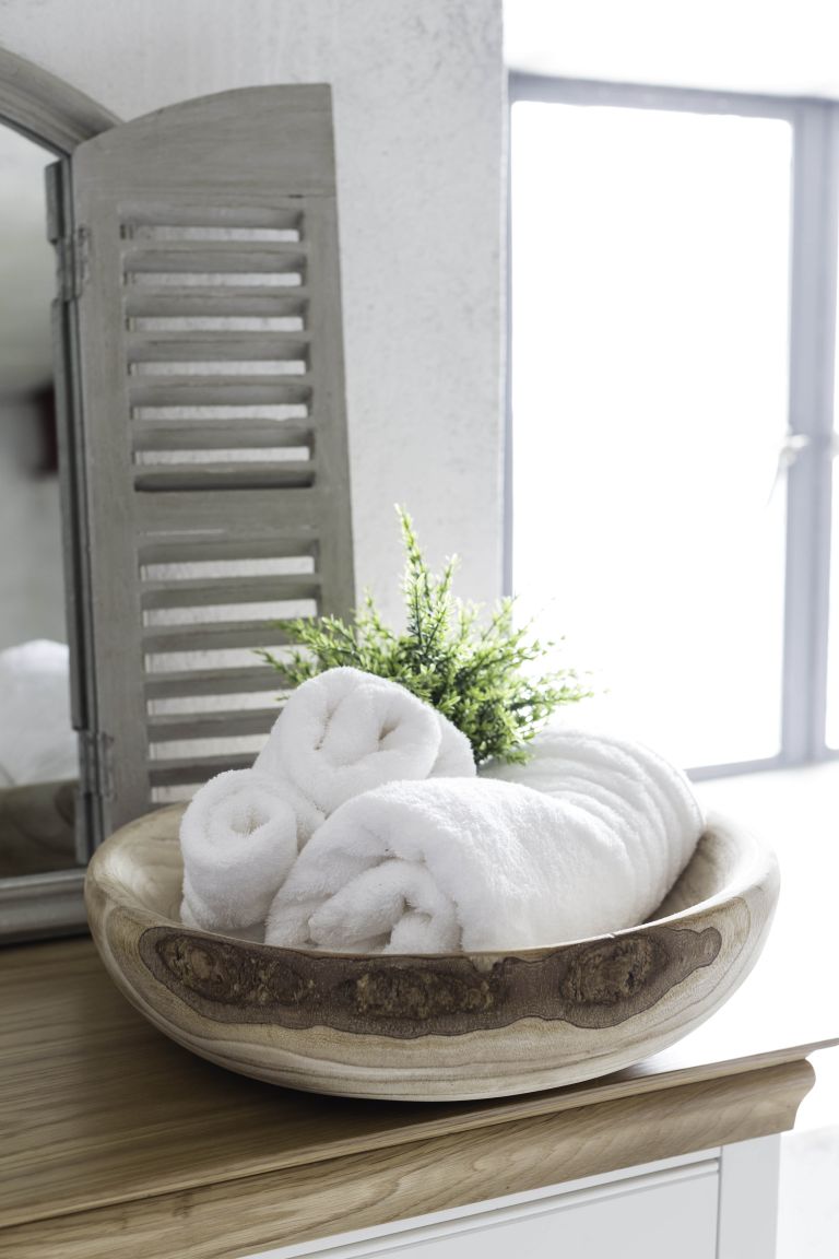 a chic wooden bowl for towels is a creative idea for a large bathroom, you may also place one for soaps