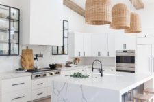 19 statement wicker pendant lamps over the kitchen island give a cozy and welcoming feel to the space