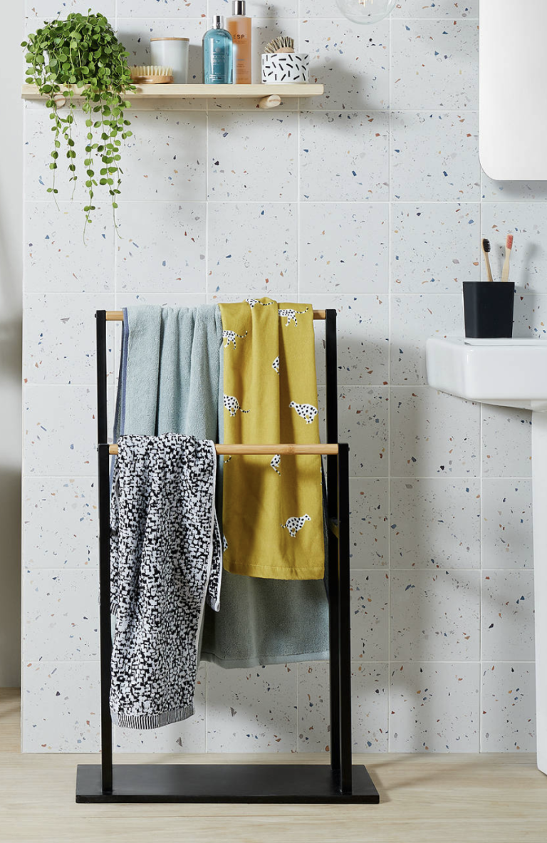 a free-standing towel rail is a nice towel storage solution for a bathroom that isn't tight on space
