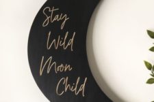 21 a stylish black matte moon sign with gold calligraphy is a lovely modern celestial decoration that can be attached anywhere
