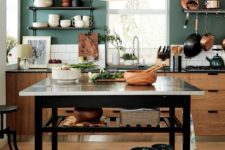 23 a functional kitchen island with two open shelves under the tabletop is a stylish and practical idea