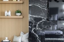 24 a TV and a built-in fireplace on a black marble panel look super chic and refined