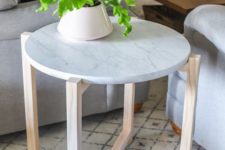 24 a stylish side table or plant stand with wooden legs and a white marble tabletop is a stylish idea
