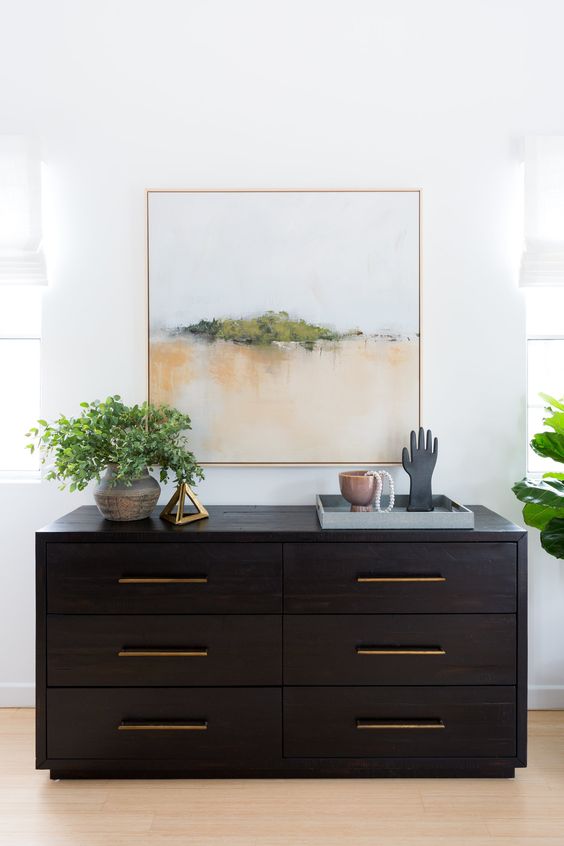 a black accent dresser will make your neutral or colorful space more dramatic and will add a bold touch
