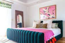 a colorful bedroom accented with a moody floral wallpaper ceiling that brings more print and evne more color to the space