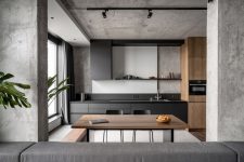 01 This modern apartment in a monochromatic color palette features a lot of concrete and looks absolutely timeless