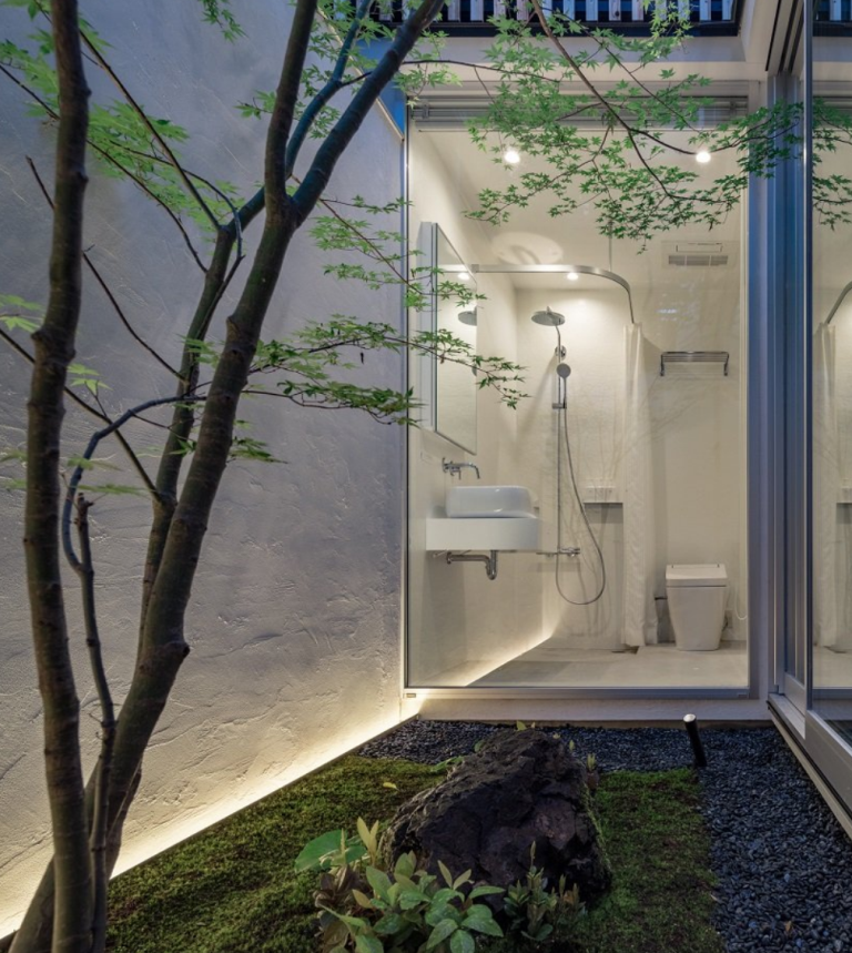 The bathroom itself is all-white and absolutely minimalist, with built-in lights