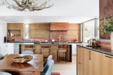 04 The kitchen and dining space are done in warm sandy shades and the design reminds of canyons