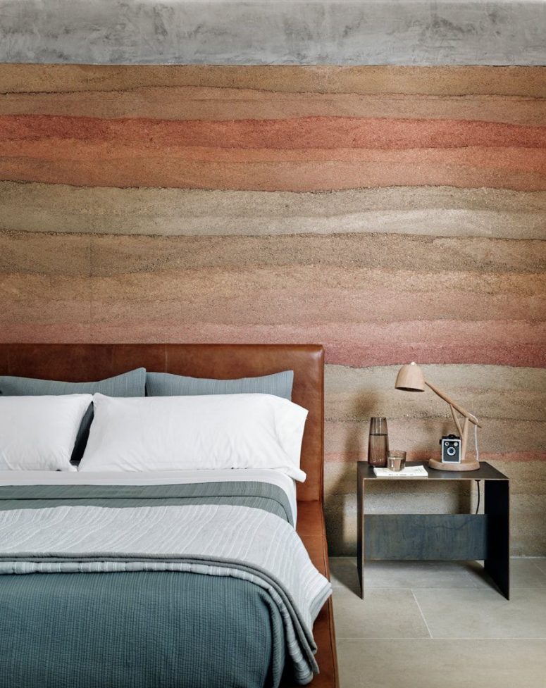 The canyon-inspired accent wall is continued in this bedroom, too