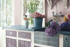 a farmhouse purple and blush kitchen with white touches to refresh it looks very romantic and very inviting