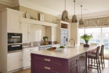 a neutral kitchen with a purple kitchen island and metallic pendant lamps is a stylish and cool idea to rock