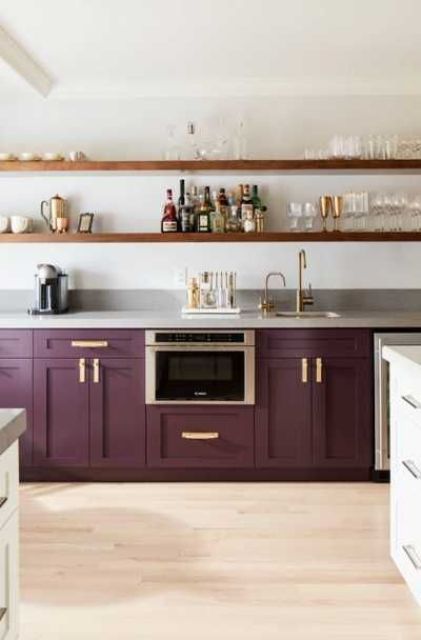a purple kitchen with only lower cabinets and open shelving instead of uppers is an elegant and chic space