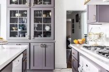 a purple kitchen with white touches to refresh it and some gold touches to make it super cool and chic