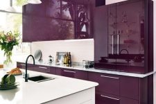 a super bright and juicy purple kitchen with a white backsplash and a white kitchen island is minimal and chic