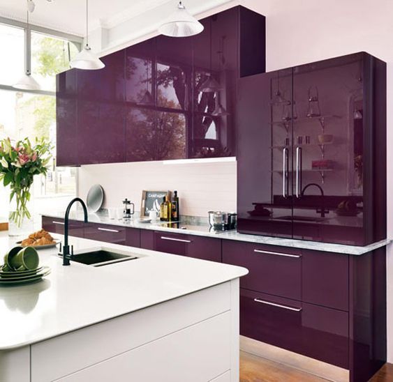 a super bright and juicy purple kitchen with a white backsplash and a white kitchen island is minimal and chic