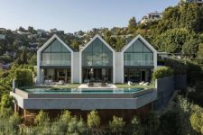 01 This contemporary house sits on top a cliff that overlooks LA and consists of three symmetrical volumes