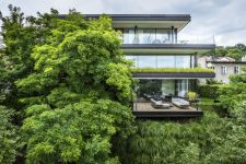 01 This contemporary riverside house features 700 square meters of space and expensive terraces on each floor