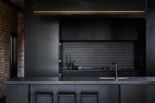 03 Black fixtures and a penny tile backsplash continue the moody color scheme