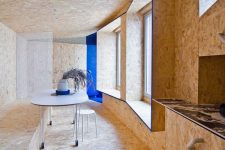 04 Inside the designer went for Warm OSB, a textural material that gives the space a cozy and warm feel