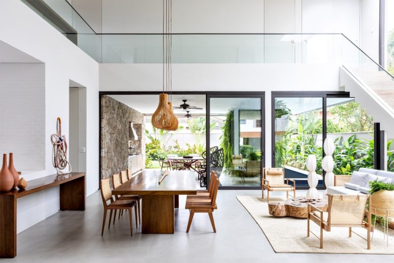 The indoor spaces continue outdoors, the owners just need to open sliding doors