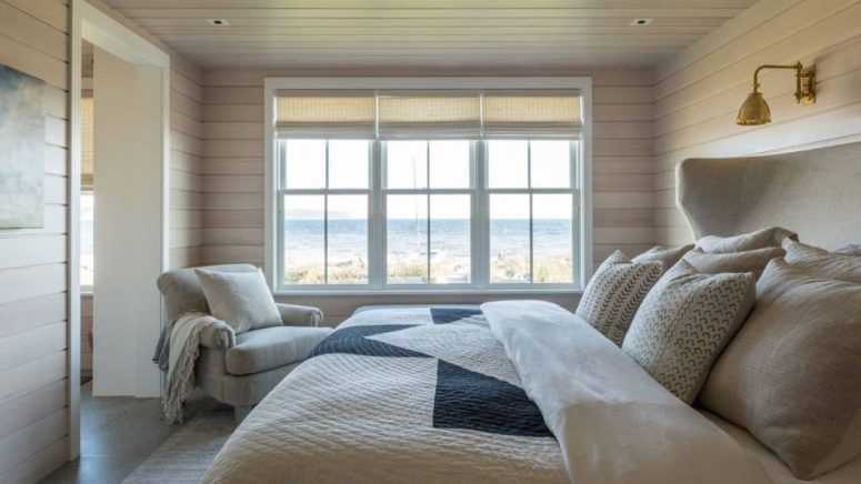 This bedroom is rather small and neutral but it features amazing sea views
