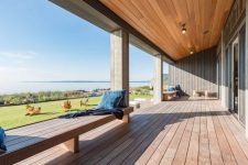 09 The covered deck is made of resilient hardwood and provides a panoramic view of the bay area