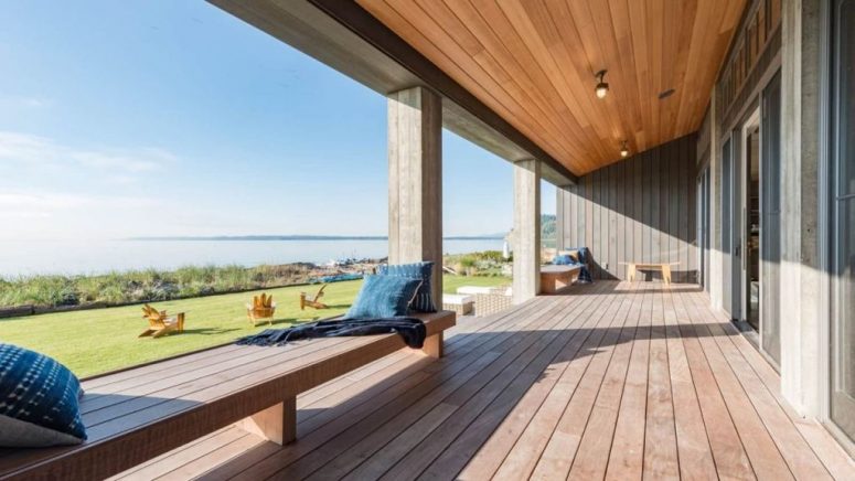 The covered deck is made of resilient hardwood and provides a panoramic view of the bay area