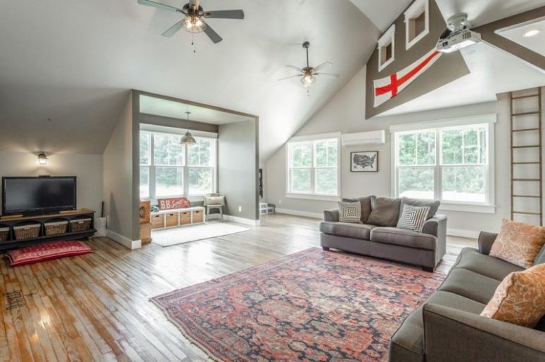 This is a bonus room with much natural light and access to a kids' play space