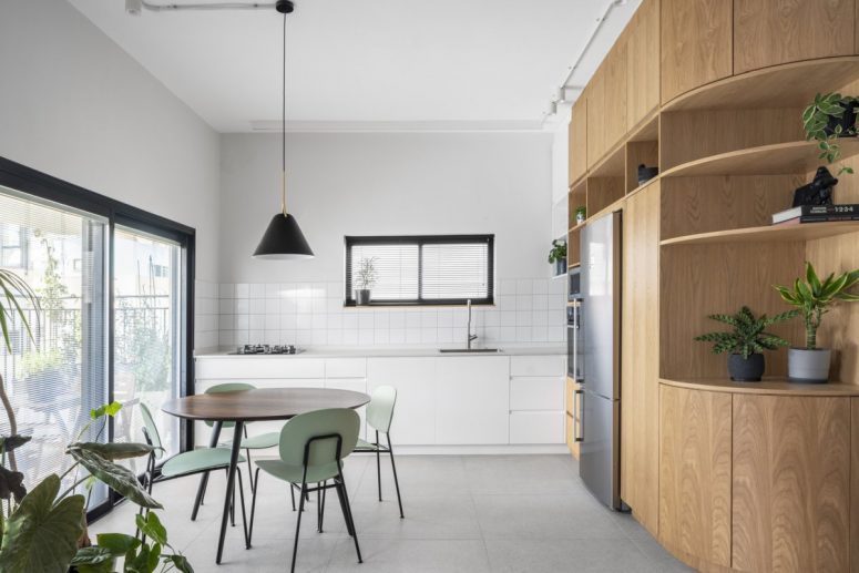 This light filled contemporary apartment is done in neutrals, it's very functional and gives all the necessary space for working from home and living