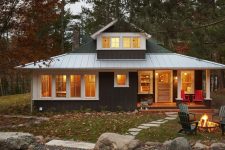 01 This rustic cabin is a stylish getaway home for a family right in the woods