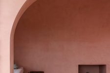 02 The interiors are rather minimal, everything here is covered with red stucco and the furniture is very simple