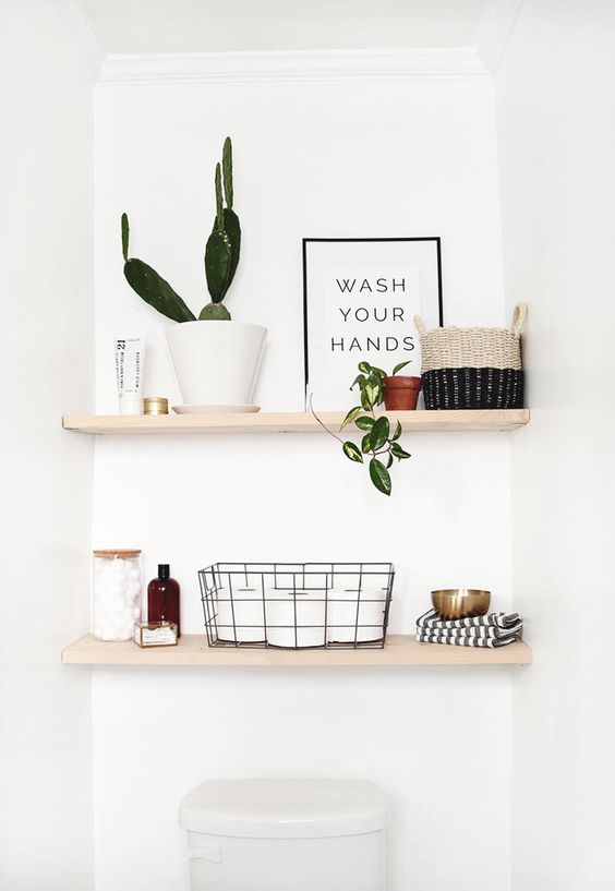 classic open shelves over the toilet are right what you need for various small stuff and even decor