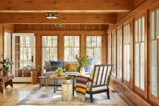 04 The sunroom is bright and fun, with bold textiles and lots of potted plants