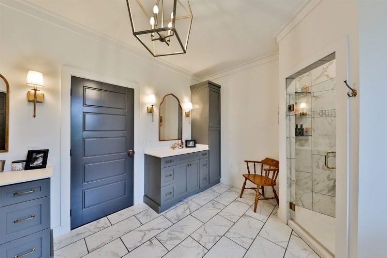 There's a comfy shower space and elegant vanities and cabinets
