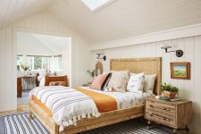 08 The guest bedroom with an additional bedroom here are done in light shades and with cozy wooden beds