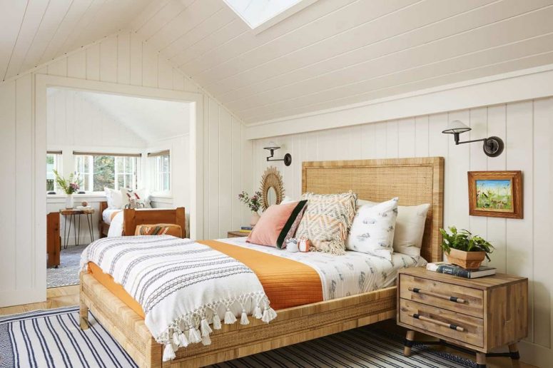 The guest bedroom with an additional bedroom here are done in light shades and with cozy wooden beds