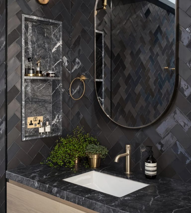 You may see elegant black marble, shiny tiles and chic gold and brass