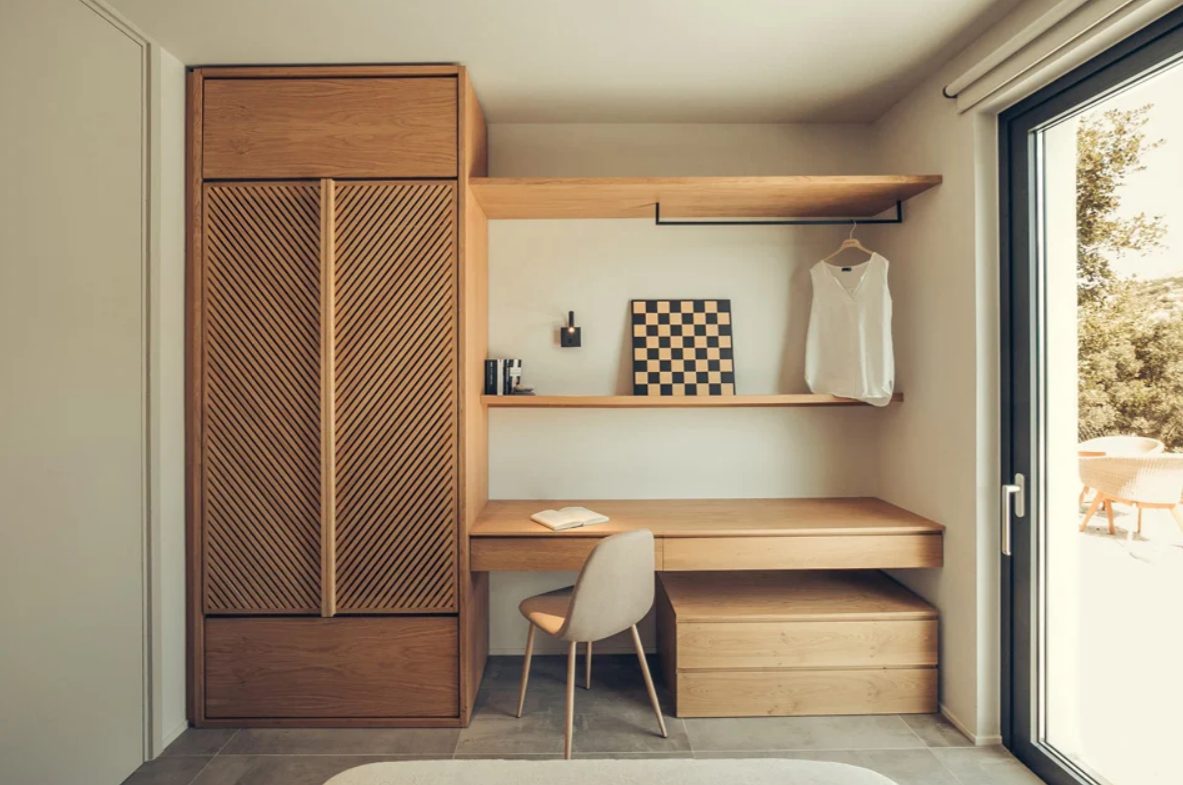 The bedroom has comfortable storage units and open shelves to make it more functional