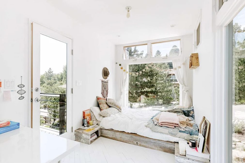 This bedroom also features cool views and an entrance to the terrace, the space is very boho