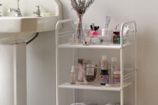 09 a stylish three-tier rolling cart will fit both a modern and vintage bathroom giving you storage space