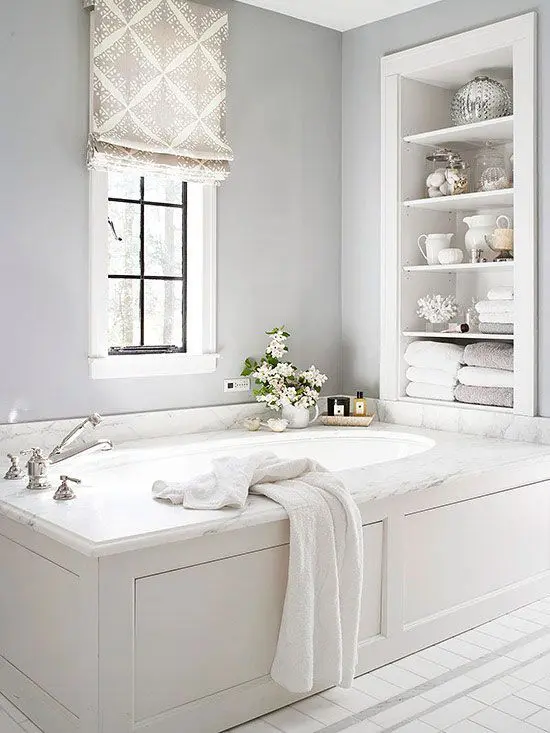Built in shelves over the bathtub are a nice solution for storing a lot of things without wasting floor space