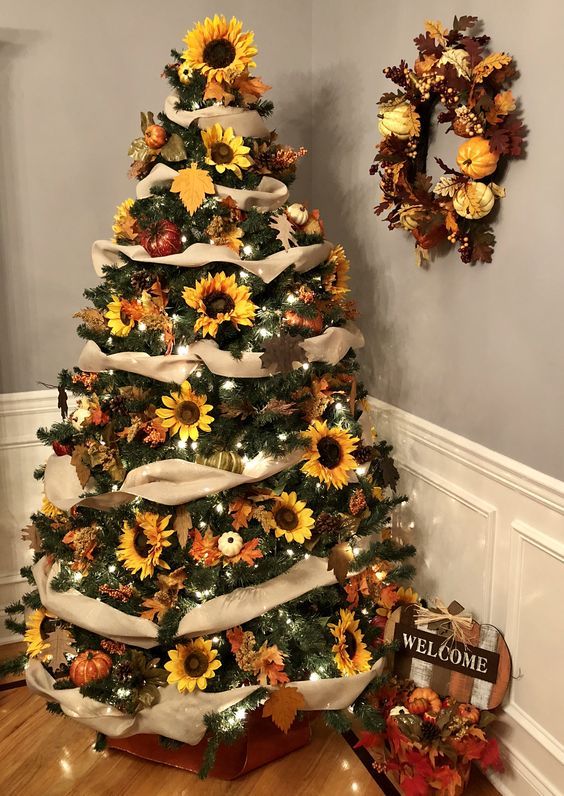 a stylish rustic Thanksgiving tree with burlap ribbons, lights, faux pumpkins and blooms, a matching wreath