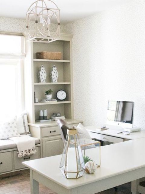 A farmhouse home office with an L shaped desk, some kitchen cabinetry for storage and sitting, lovely decor and a cool pendant lamp