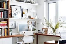 a stylish modern home office with an L-shaped desk, a white chair, open shelves and bookshelves is a comfortable working space