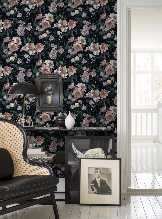 a dark floral realistic accent wall and dark refined furniture for a chic and charming space with a vintage feel