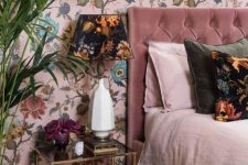 03 a refined bedroom with a pink floral accent wall and a dark floral table lamp that echoes with it