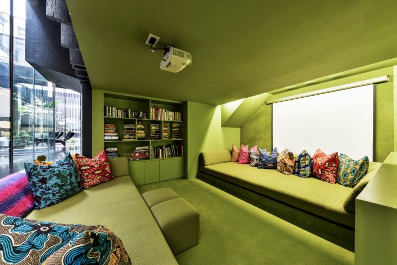 There's a projector and built-in bookshelves in the conversation pit